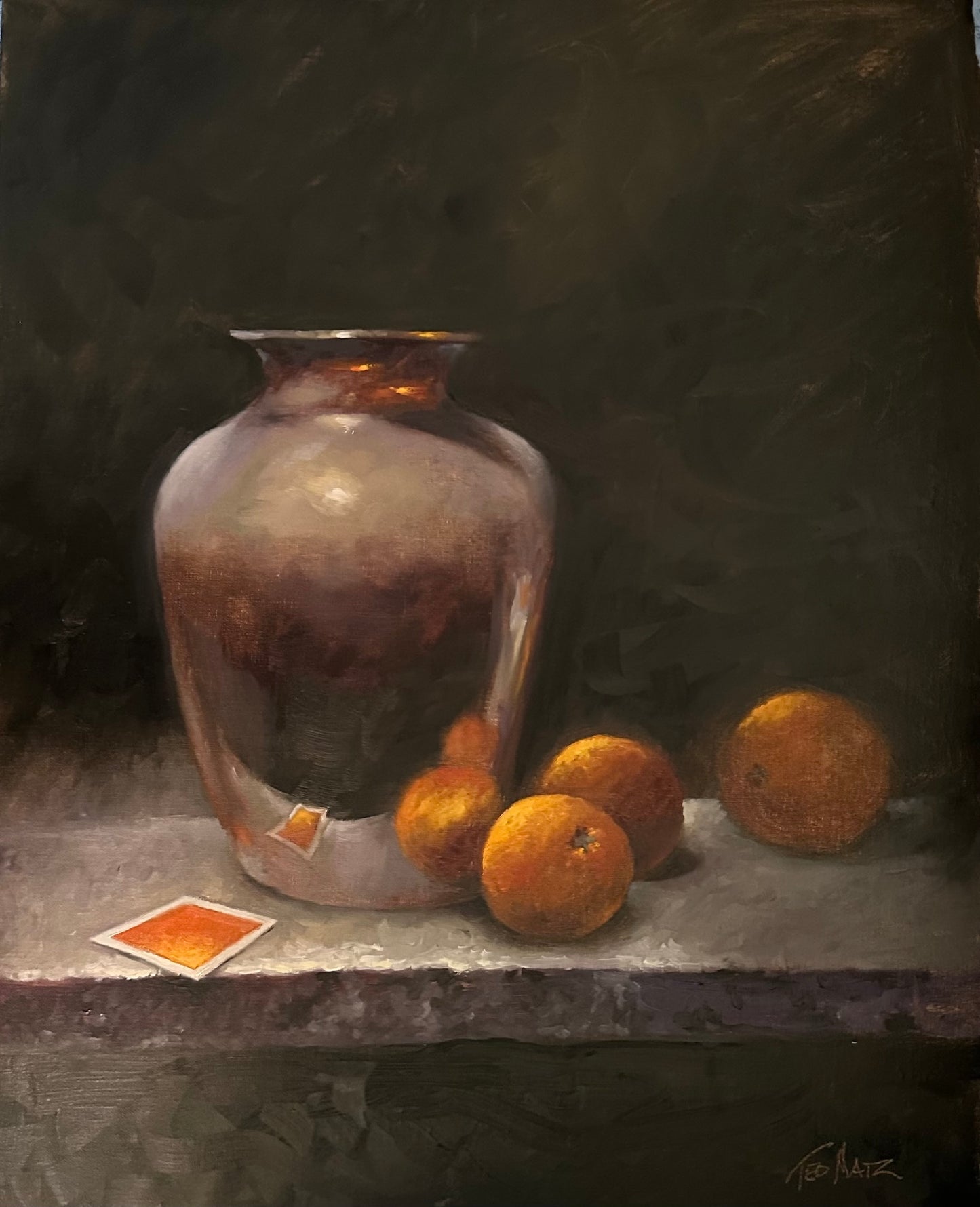 Still life painting of a silver vase and oranges on a table against a dark background and an orange card in foreground